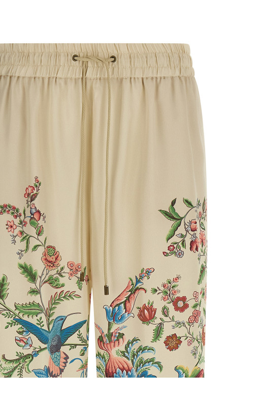 Flora and fauna printed trousers Beige
