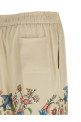 Flora and fauna printed trousers Beige