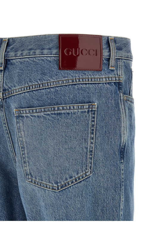 Джинсы с эффектом выцветания Blue GUCCI 844629XDDD24009