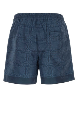 Printed polyester swimming shorts GUCCI (856212XHALB)