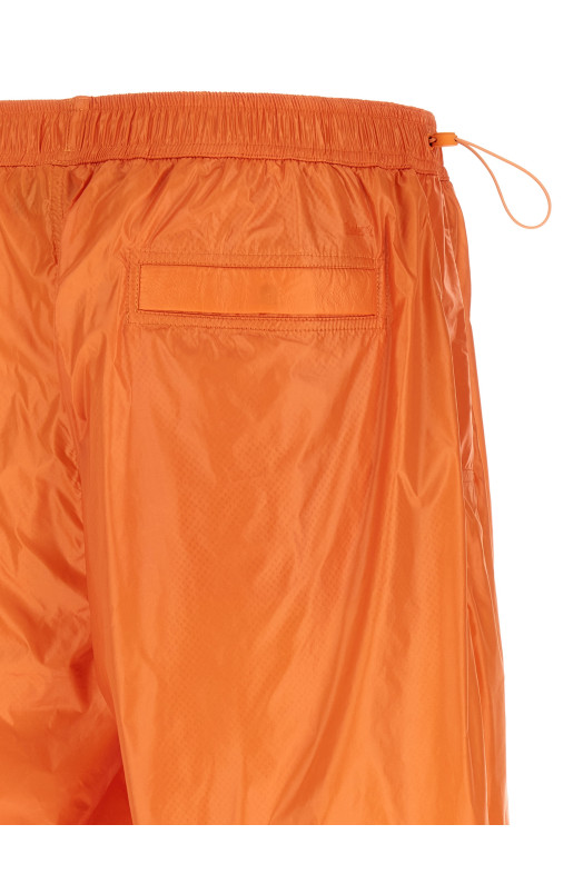 Shiny nylon bermuda shorts orange