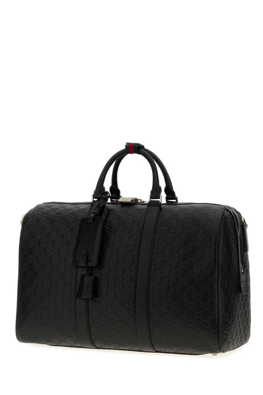 Black leather Emblem travel bag GUCCI (850220AAFOM)
