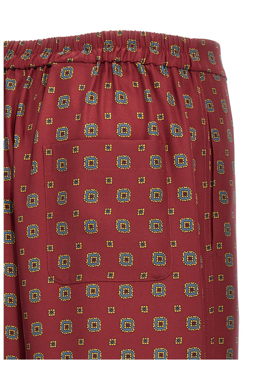 Брюки с узором Бордо MOSCHINO (A030654551139) Брюки с узором Бордо MOSCHINO (A030654551139)